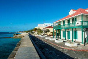 View of the beachfront with the colonial houses of Cockburn town, Grand Turk, Turks and Caicos View of the beachfront with the colonial houses of Cockburn town, Grand Turk, Turks and Caicos